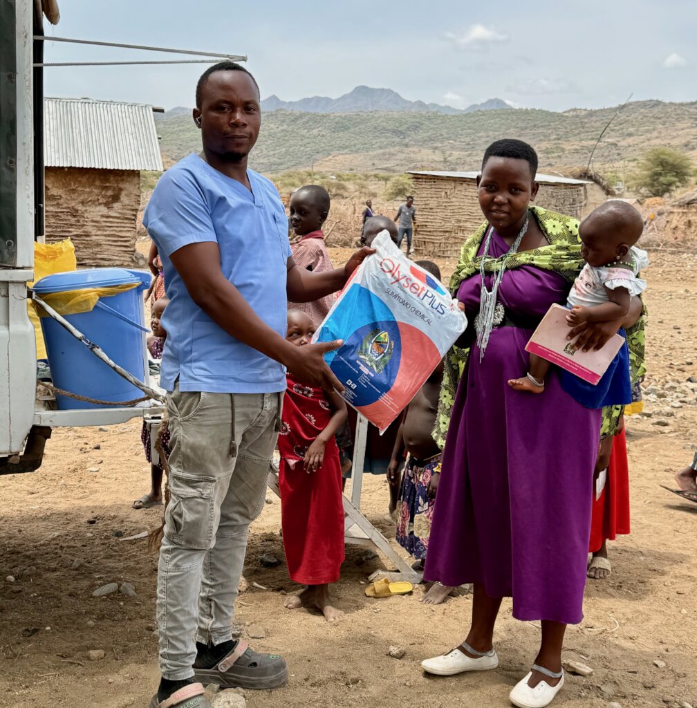 Pregnant mothers receive mosquito nets at clinic