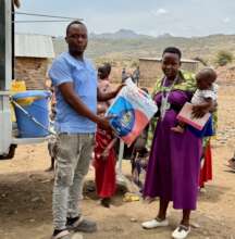 Pregnant mothers receive mosquito nets at clinic