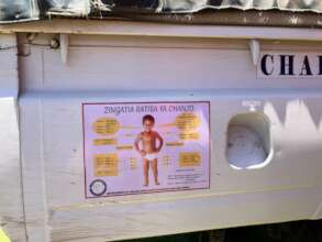 Vaccine Schedule on side of Mobile Medical Vehicle