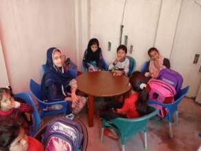 Children complete their school homework at WPTGF