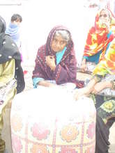 Aged Woman after Obtaining Quilt n