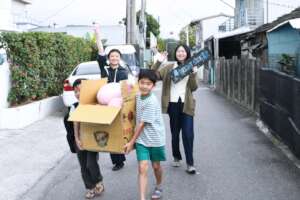 Youth carrying gifts and necessities home