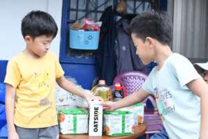Helping to unpack necessities and food staples