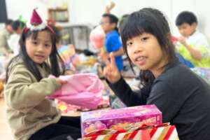Children with their beautifully wrapped gifts