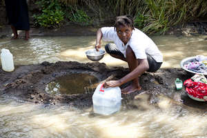 Collecting Drinking Water from the River