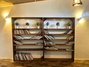 A bookcase in a peaceful corner