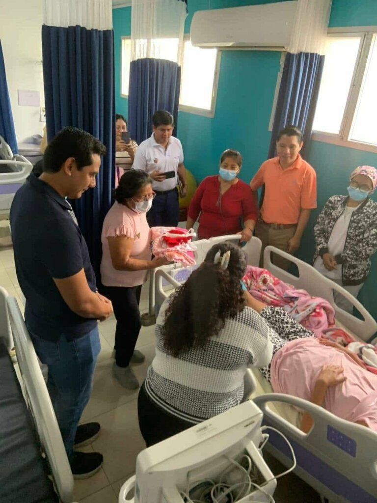 Presenting a new mother with handmade baby items.