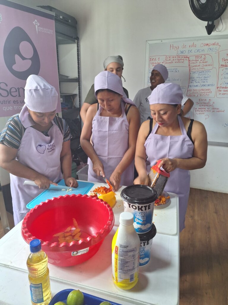 Our food bank families learning healthy recipes.