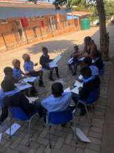 Reading with learners at Sefikeng School