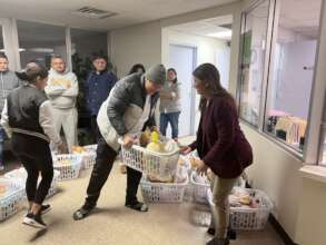 Immigrant Family receiving food basket