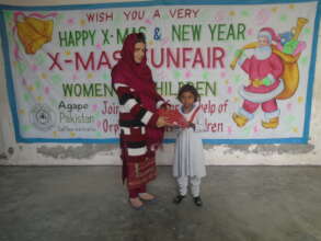 little school girl recieving christmas gift