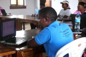 Debora with blue tshirt--studying