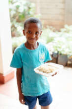 Children with meals at our centre