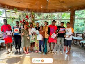 Smiles on the faces of orphans holding their Gifts