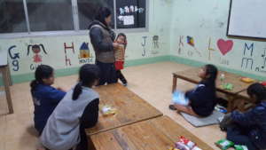 Kru Mai with one of her youngest students