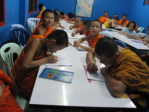 Novice monks from the local temple working hard!