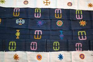 Cotton strips with embroidered symbols