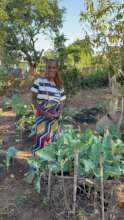 Beneficiary with her backyard garden