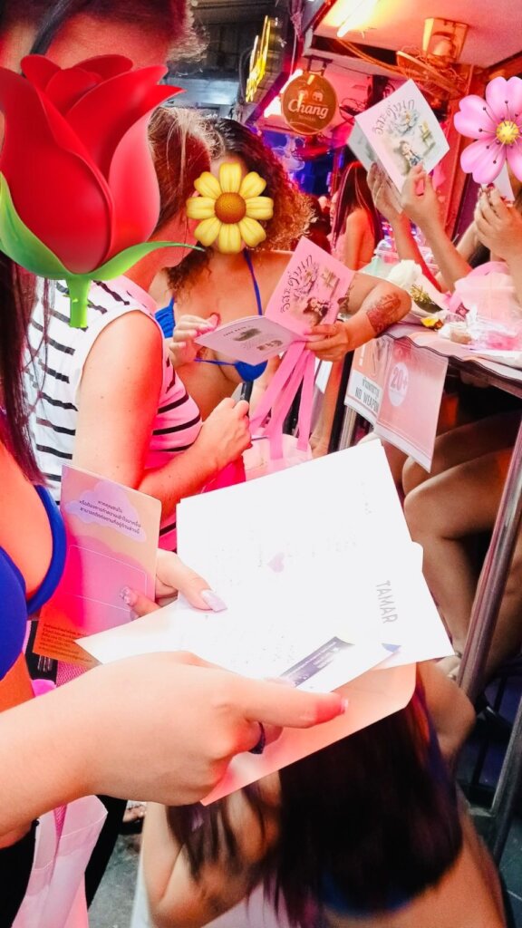 Women reading the books that were in the bags