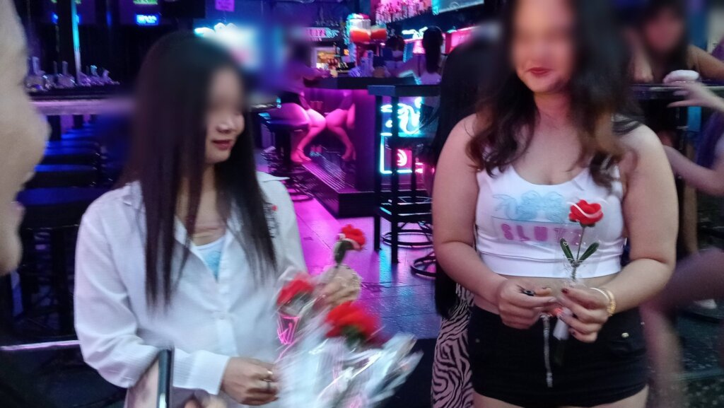 Giving out roses and bags!