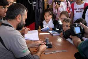 Children learn bird banding with experts at Aras