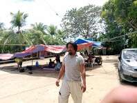 Man stands near tents set for temporary shelter