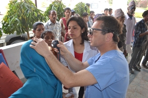 Dr. Sharma and Dr. Tabin examine patients