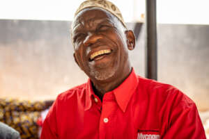 Hussein's relief and joy are evident on his face.