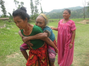 Patient carried to an Eye Camp