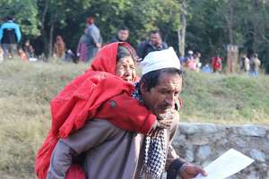 Patient carried to outreach in Nepal.