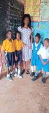 Teacher in  class with children