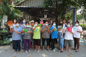 Community members proudly show off new products