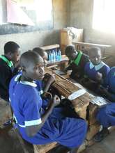 Girls learning to make sanitary pads