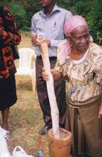 Michael: Using mortar and pestal to grind cassava