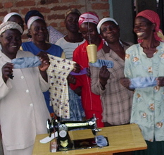 Women's group displaying reusable sanitary towels