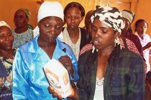 Michael's community members viewing cassava flour