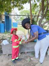 Image of I-SEEED Founder and Child