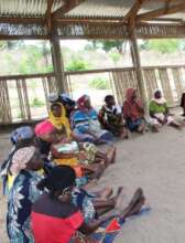Community members in Tete gather in a peace circle