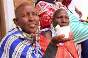 Maasai women with yogurt made in the dairy