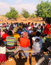 Youth leader promotes child registration.