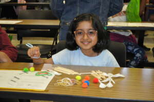 Young Girl Doing Hands On STEM Activity