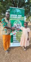 An orphan girl receives an article of clothing