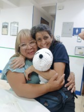 A deafblind weaver happy with the doll she made