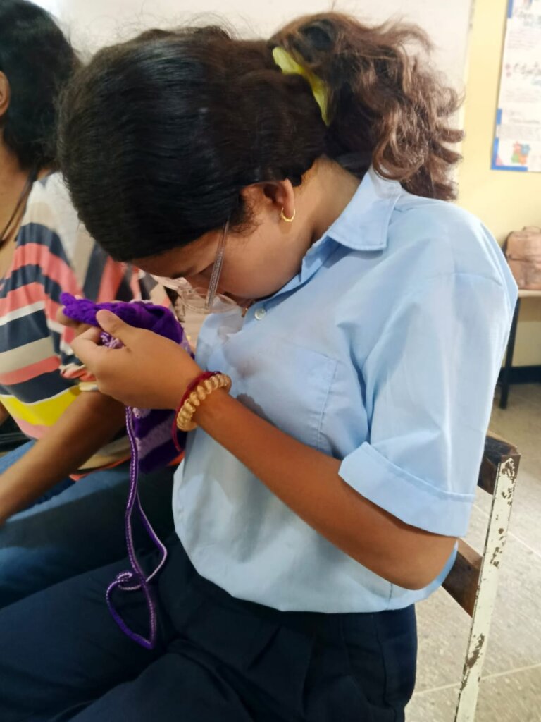 Girl with low vision crocheting