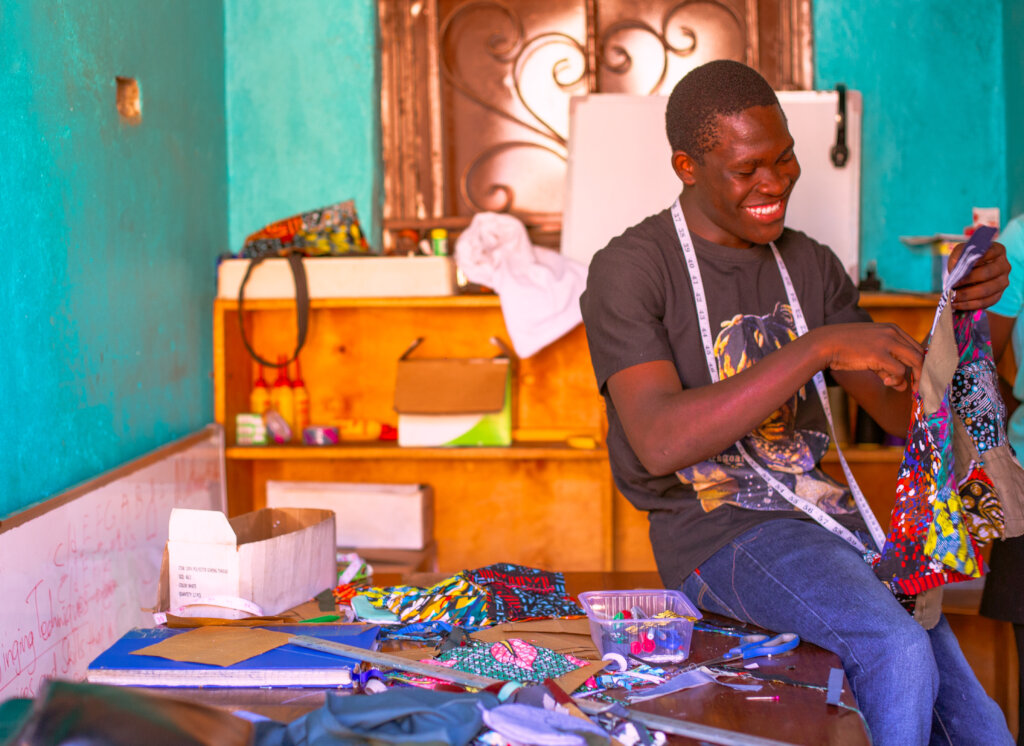 Denis working a fabric in the tailoring room