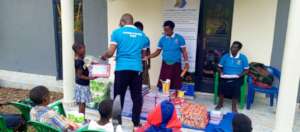 THE CHILDREN RECEIVE THEIR ESSENTIAL ITEMS.jpg