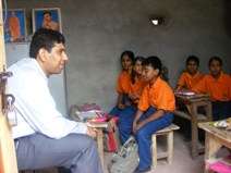 Volunteers from Dell with children