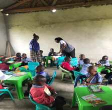 Children enjoying their new chairs and tables