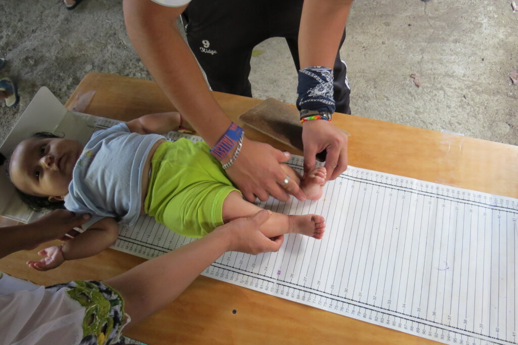 child being measured