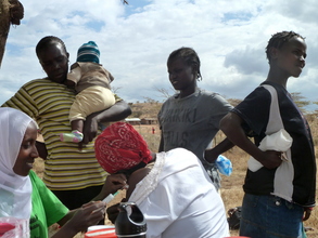 Women in line to receive contraceptives
